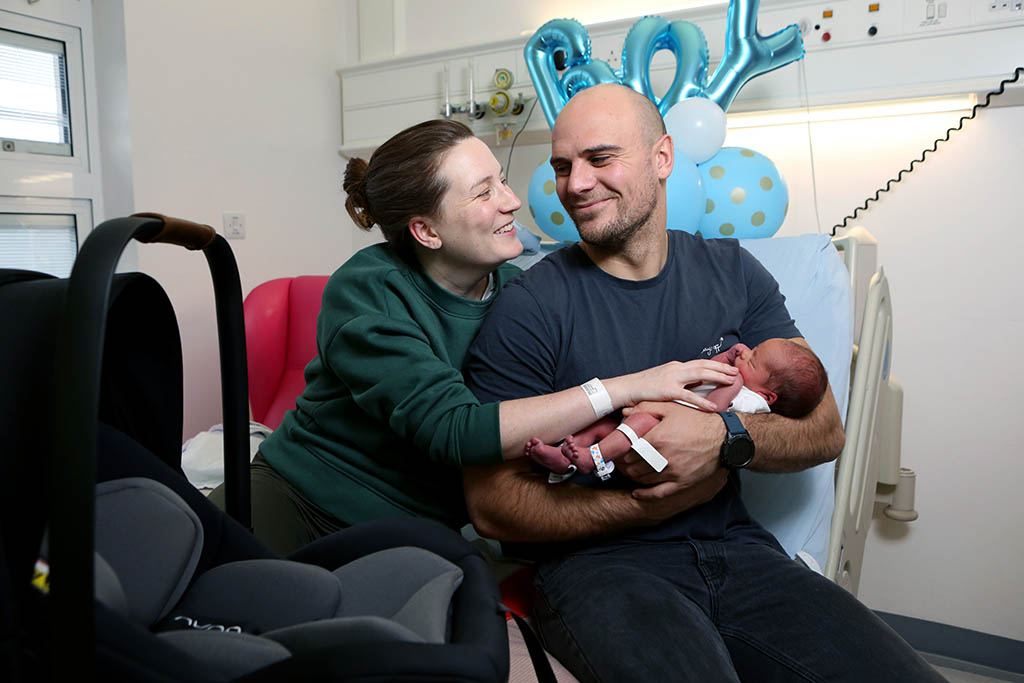 Families celebrate Christmas with their new babies. king | Families celebrate very special Christmas gifts